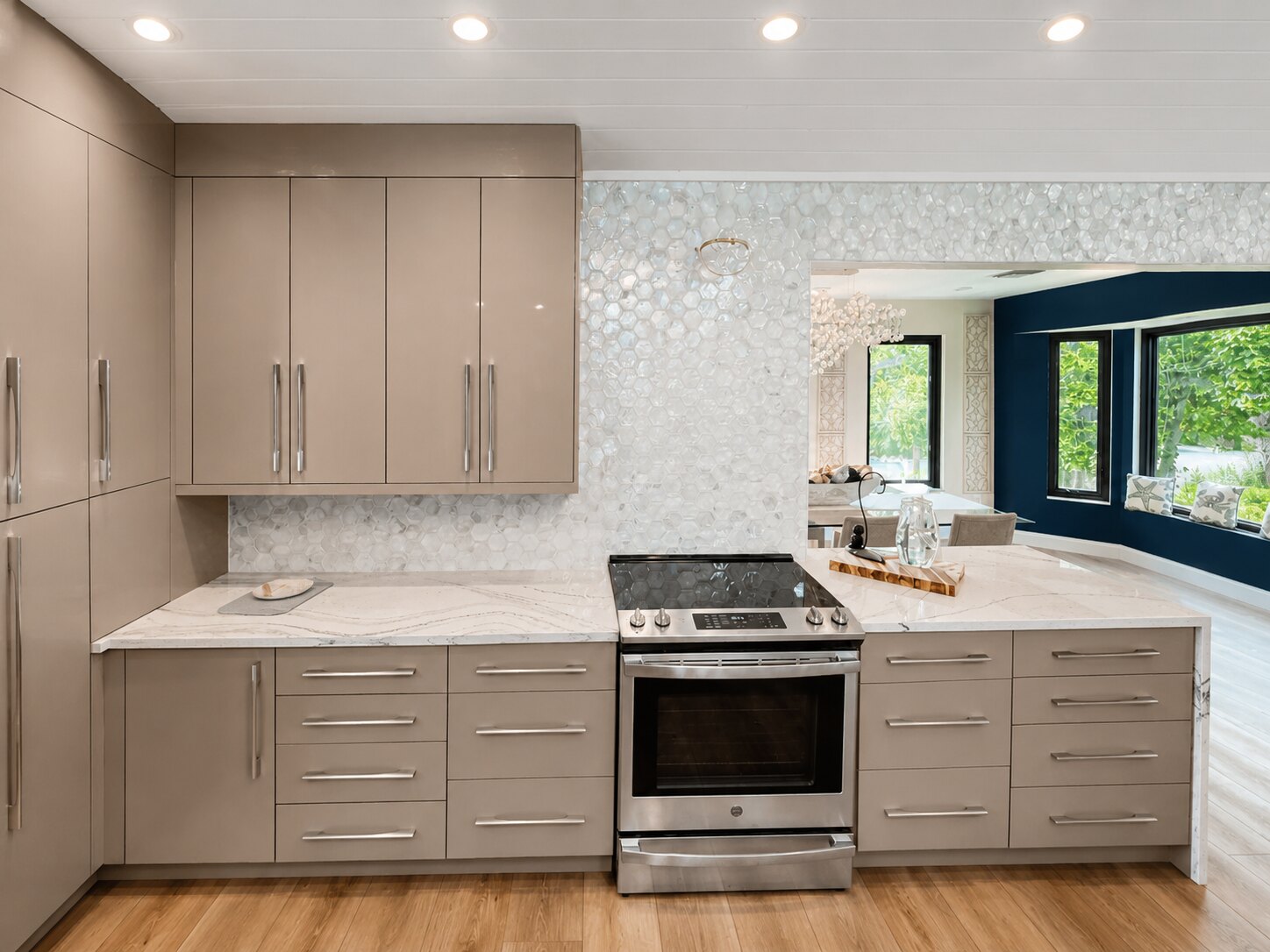 Completed renovation connecting the kitchen and adjacent living area by Proskillz Remodeling
