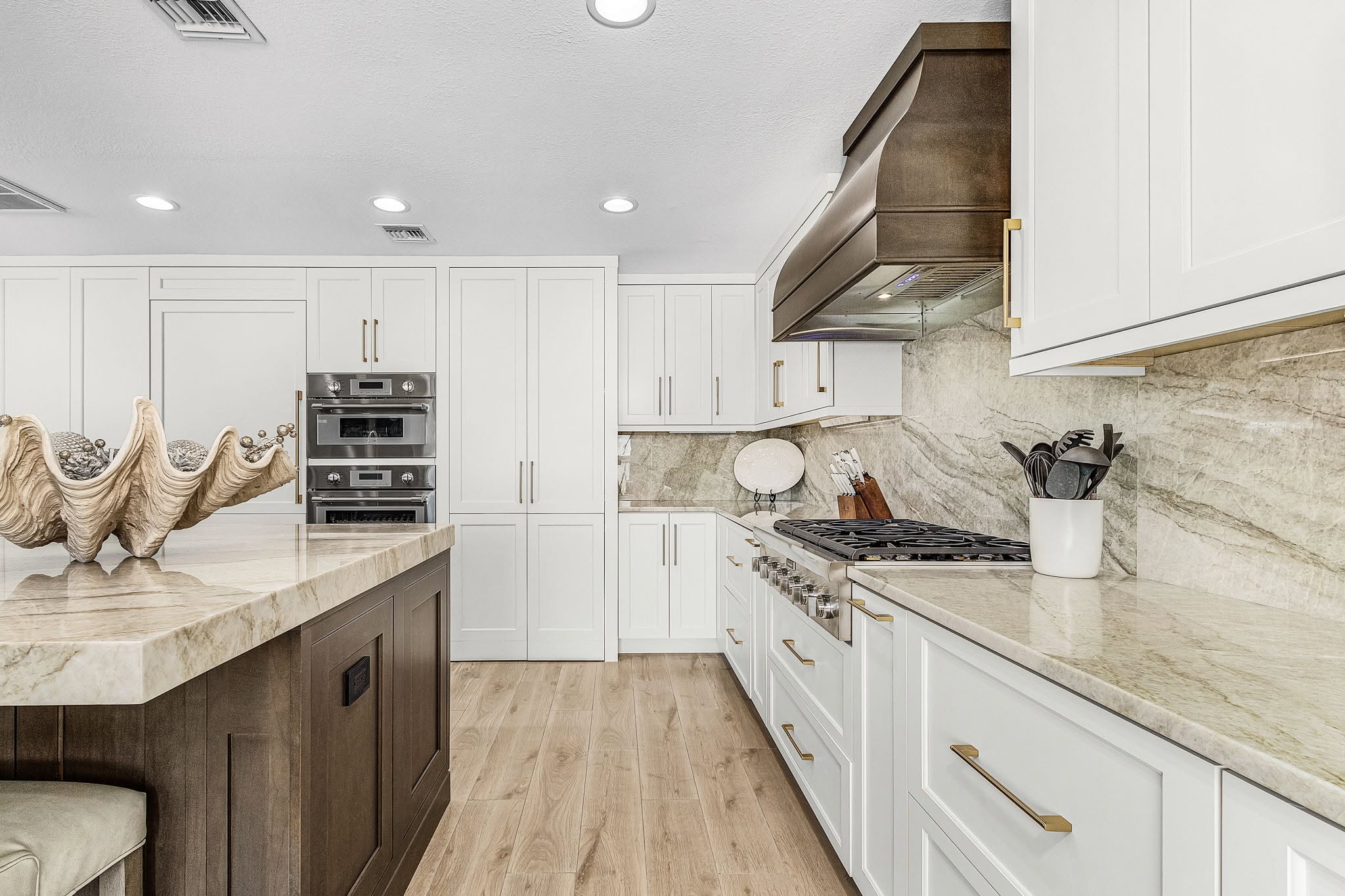 Completed kitchen renovation centered around a coordinated cooking area by Proskillz Remodeling