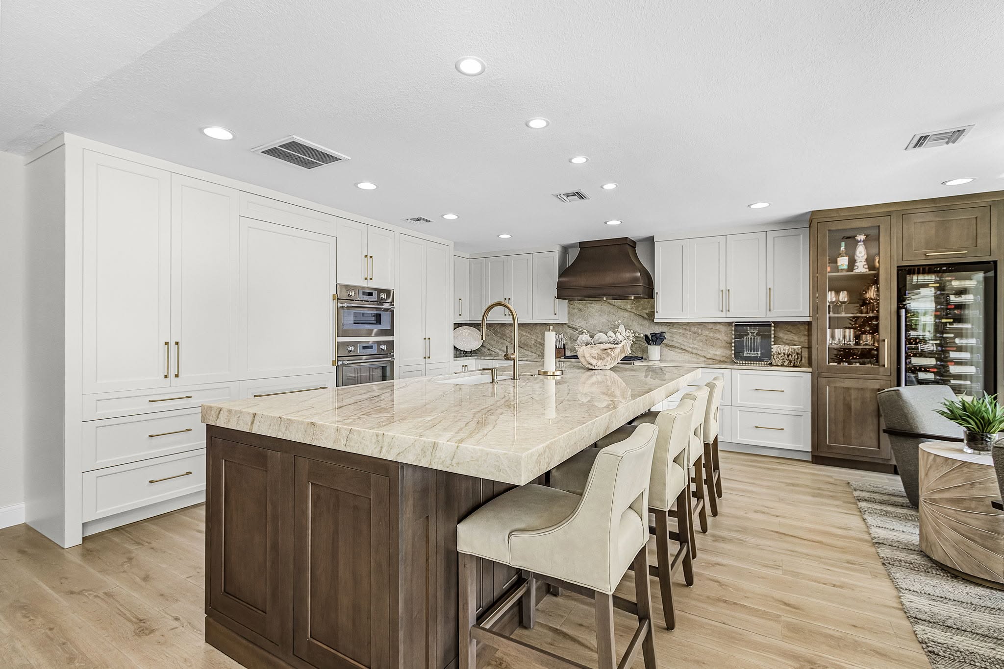 Completed kitchen remodel with an open peninsula and balanced lighting by Proskillz Remodeling