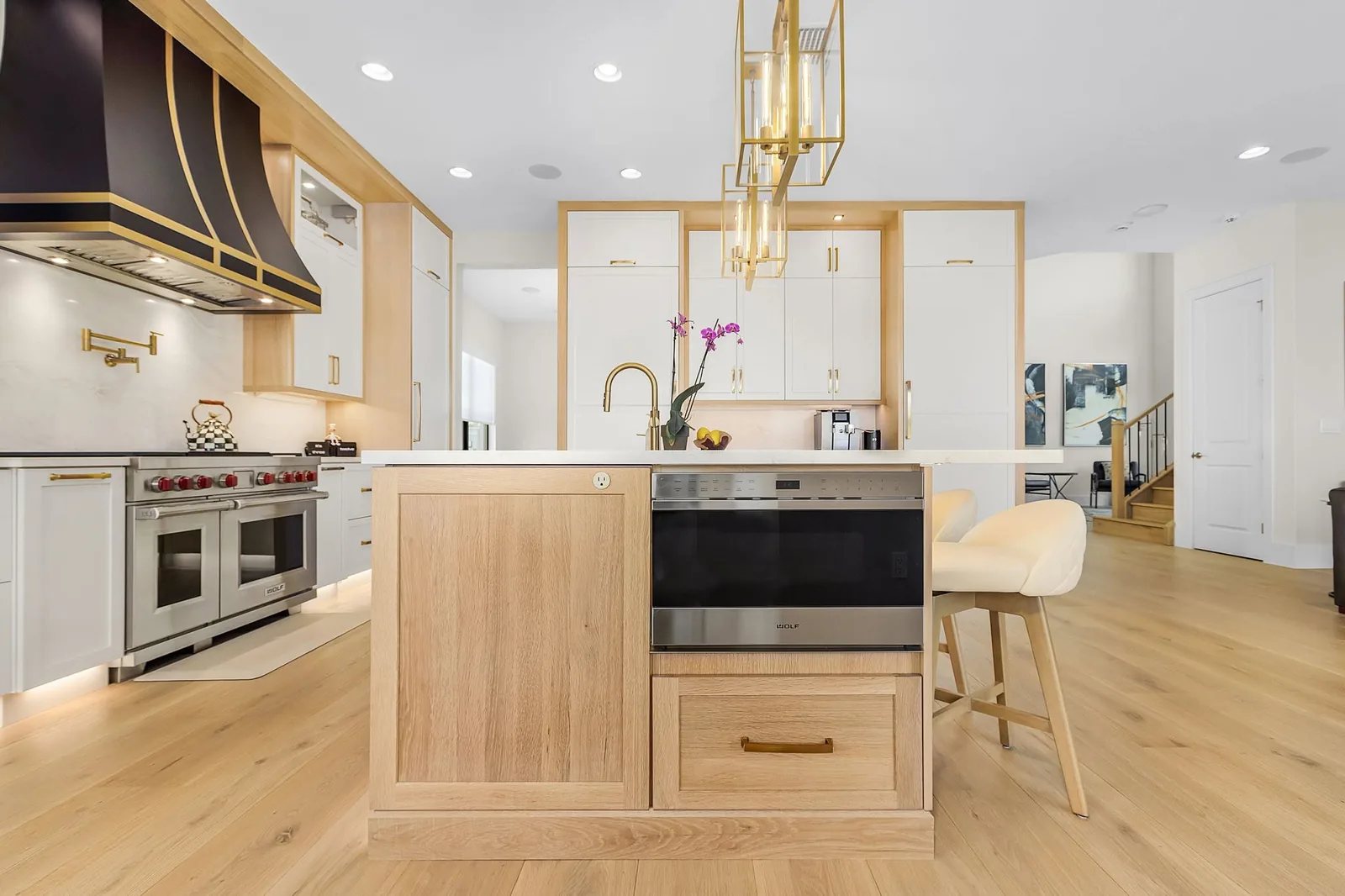 Completed Proskillz kitchen with coordinated cabinetry, island and built-in appliance details